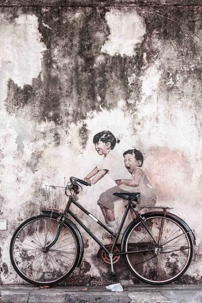 Penang street art mural kid on bicycle