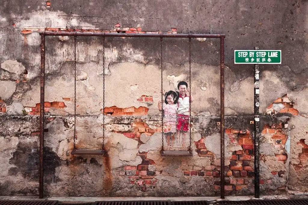 Penang street art mural kid on swing