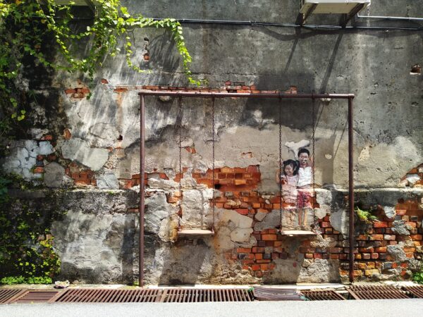 Penang-Mural-Brother-and-Sister-on-A-Swing-scaled