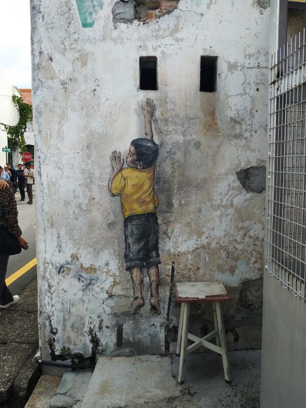 Penang-street-art-Boy-on-the-Chair-scaled