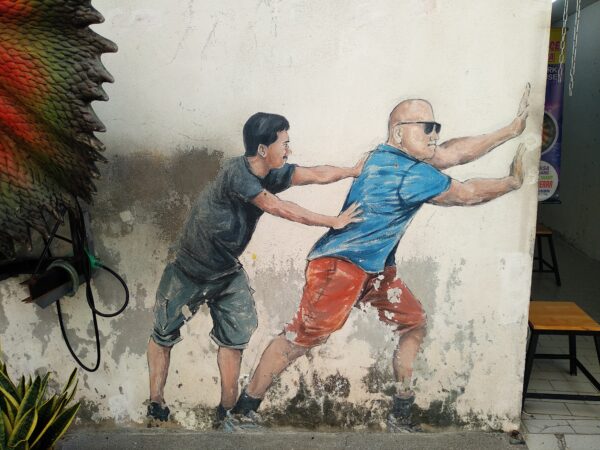 Penang-street-art-Two-Men-Pushing-Door-scaled